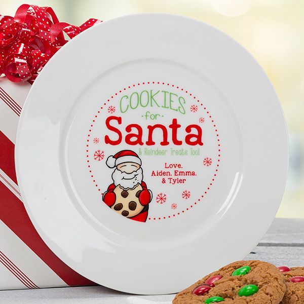 cookies in a gift box with santa's cookie on the plate