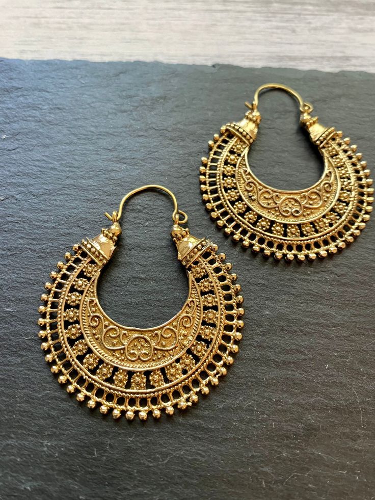 Stunning Tribal Hoop Earrings, a perfect blend of contemporary fashion and ethnic charm. Handcrafted with precision and passion, these earrings are designed to make a statement. 🌟 Key Features: - Unique tribal-inspired design - Handcrafted with sturdy high quality brass for durability  - Versatile, ideal for casual or dressy occasions - Skillfully crafted for a touch of authenticity ✨ Product Details: Embrace the allure of tribal aesthetics with these hoop earrings. Their distinctive design captures the essence of tradition and modernity, making them a must-have accessory for your collection. 🎁 Perfect Gift: Whether treating yourself or surprising a loved one, these tribal hoop earrings make a thoughtful and stylish gift. Perfect for birthdays, celebrations, or just because. ⚡️ Keywords: