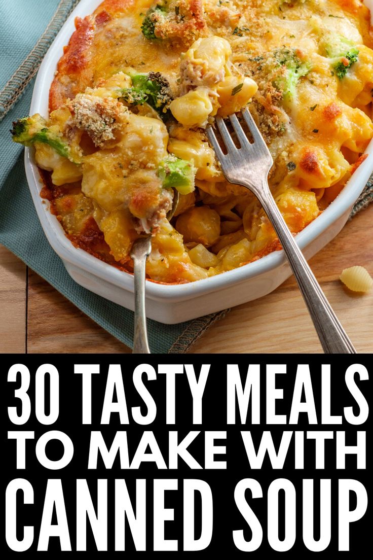 a casserole dish with broccoli and cheese in it on a wooden table