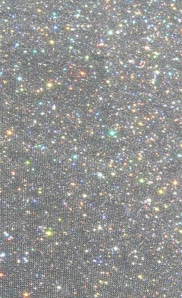 the back side of a black fabric with small glitters