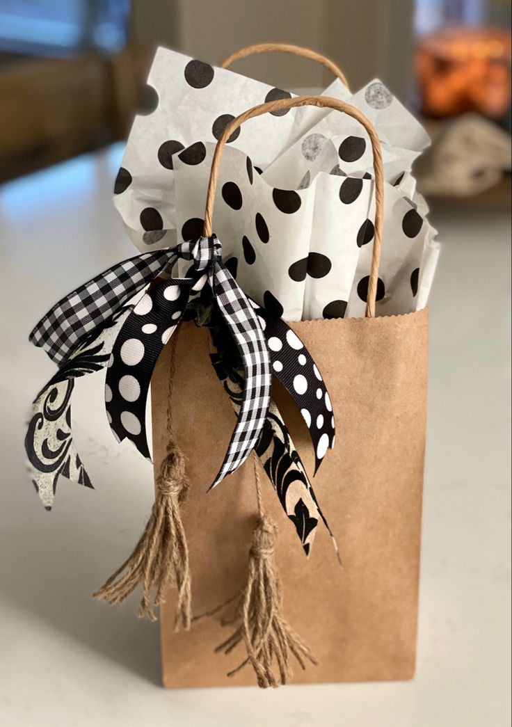 a brown paper bag with black and white polka dots on it