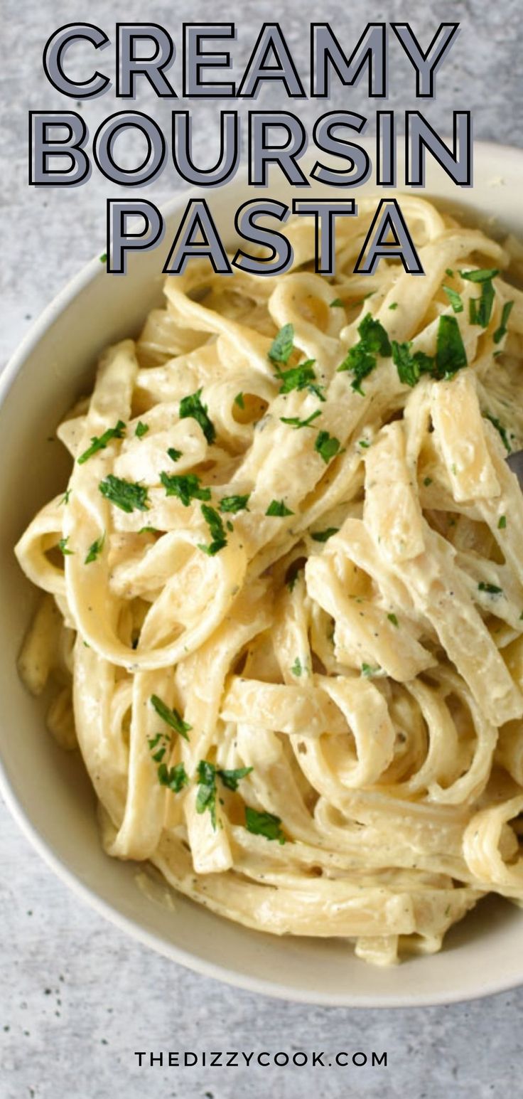 creamy bourssin pasta in a white bowl with parsley on top and text overlay