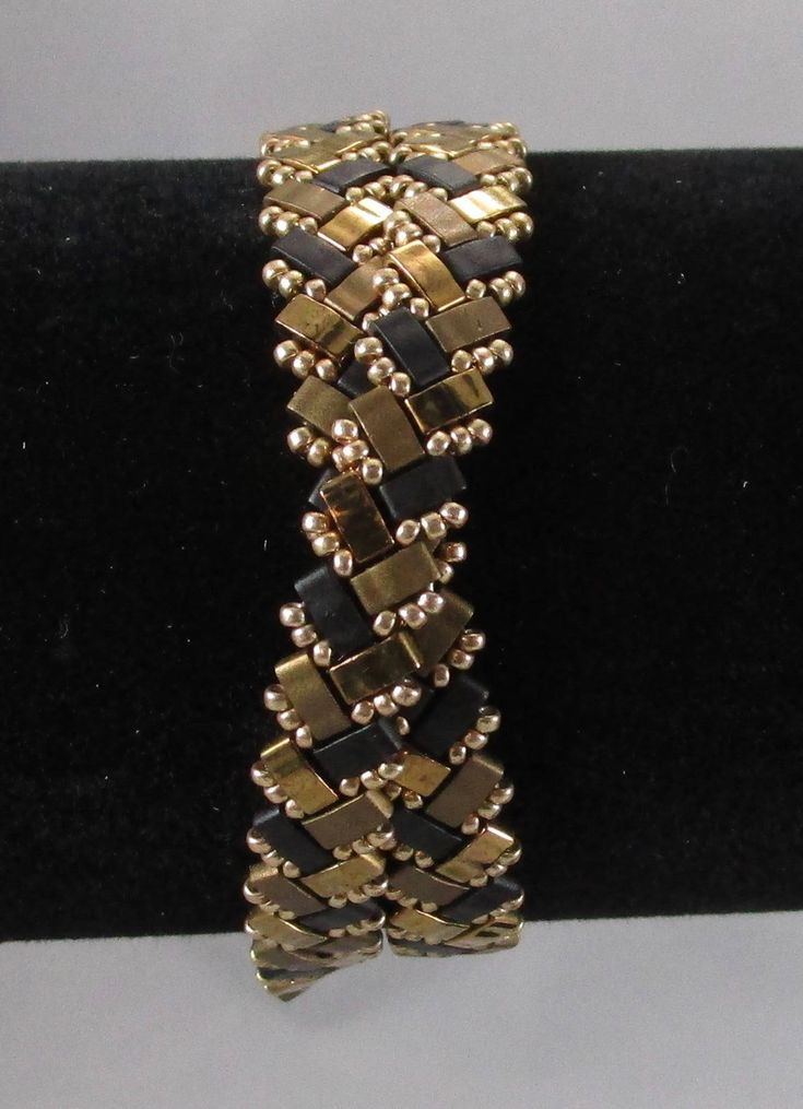 This wrap is a multi gold/black bracelet.  It can be ordered as a single wrap, a double wrap, or a triple wrap.  Many times a double wrap can serve as a choker as well.  Please measure your wrist and tell me the size you need. Elegant Black Metal Wrap Bracelet, Gold Hand-wrapped Beaded Bracelets For Party, Gold Hand Wrapped Beaded Bracelets For Party, Gold Wrap Bracelet For Parties, Gold Metal Wrap Bracelet For Party, Elegant Handmade Gold Wrap Bracelet, Elegant Handmade Black Wrap Bracelet, Black Bracelet, Wrap Bracelets