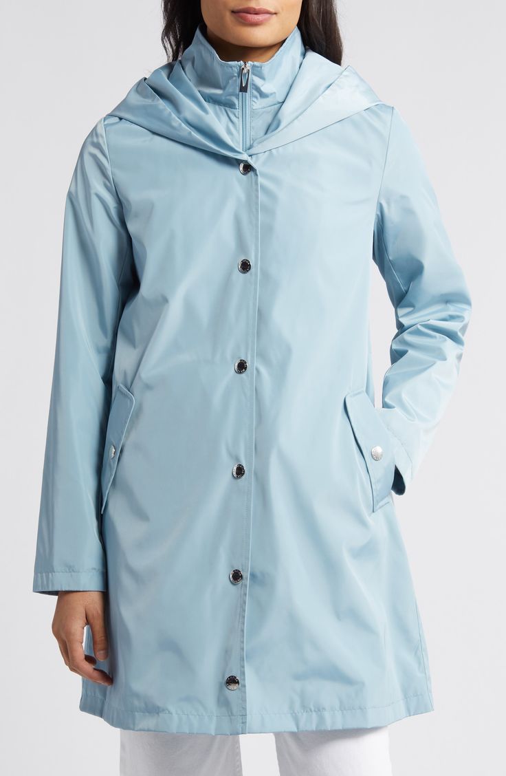 Stay dry on dreary days with this packable, water-resistant jacket featuring an attached hood, interior zip-front bib and handy snap pockets. 35 1/2" length Front snap closure Fixed hood Front snap pockets Attached bib with zip-front closure Packs into pocket Lined 100% polyester Machine wash, line dry Imported Functional Blue Raincoat With Pockets, Travel Raincoat With Double-lined Hood, Casual Nylon Raincoat With Storm Flap, Travel Windbreaker With Detachable Hood, Blue Waterproof Windbreaker For Travel, Spring Raincoat With Storm Flap For Outdoor Use, Solid Raincoat With Adjustable Hood For Travel, Travel Raincoat With Adjustable Hood, Solid Color Raincoat With Adjustable Hood For Travel