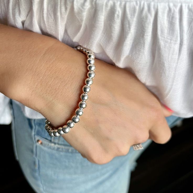 ...chic and timeless. Our Beaded Stack Bracelet comes to you in sterling silver stretch style. Sterling bead bracelets are chic and timeless and never go out of style. Available in 6mm beads and you pick the bracelet size, small/medium, medium/large, or large/x-large. Wear one or combine it with additional stacks to create your own custom look. Metal: .925 Sterling SilverFinish: High PolishMSRP: $129.99-$139.99 Part of the appeal of handcrafted sterling silver jewelry includes slight variations Trendy Silver Stretch Bracelet With Round Beads, Stackable Round Stretch Bracelet, Dainty Everyday Stretch Bracelet, Dainty Round Stretch Bracelet For Everyday, Everyday Dainty Stretch Bracelet, Dainty Silver Stackable Stretch Bracelet, Hypoallergenic Beaded Bracelets With Round Beads, Dainty Silver Stretch Bracelet, Casual Silver Stackable Jewelry