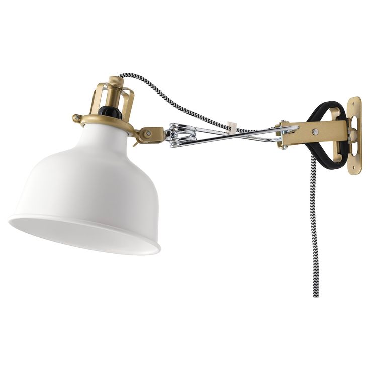 a white light with a black cord attached to the arm and an adjustable lamp shade