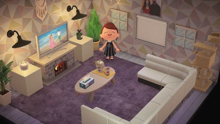 a living room scene with a person standing in the middle of the room looking at something on the tv