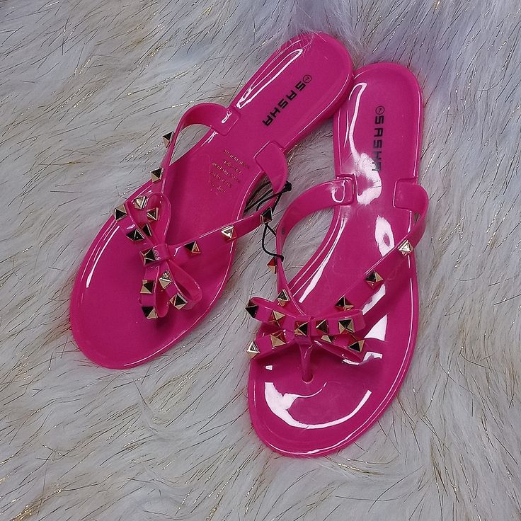 These Pink Thong Sandals Are Perfect For The Spring And Or Summertime Cute With A Pink Bow And Gold Studs Where To The Beach Or To The Pool Or Just Out For Casual Cute Day Size 7 These Are New But They Will Not Have A Tag Attached Adjustable Pink Jelly Sandals For Beach, Pink Open Toe Flip Flops For Summer, Casual Pink Party Flip Flops, Pink Adjustable Jelly Sandals Casual Style, Casual Adjustable Pink Jelly Sandals, Casual Pink Adjustable Jelly Sandals, Adjustable Pink Flip Flops For Beach, Trendy Pink Flip Flops For Summer, Casual Pink Toe Post Flip Flops