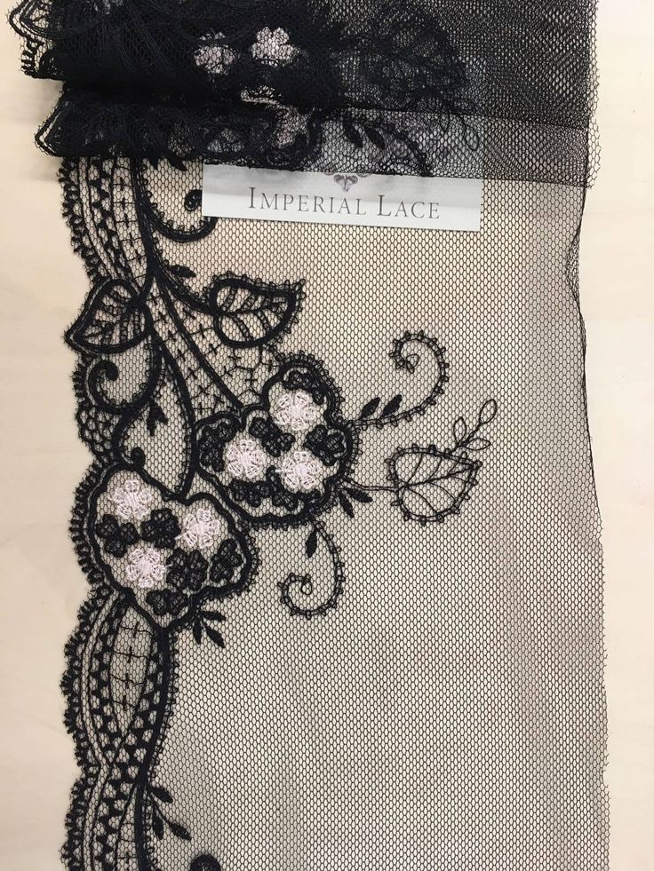 black lace with flowers and leaves on it