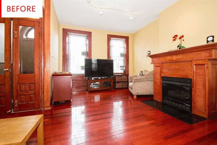 an empty living room with wood floors and a fire place in the corner, before and after remodeling