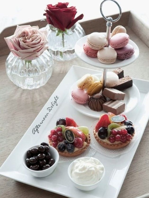 three trays filled with different types of pastries