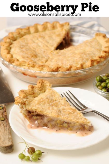 a close up of a pie on a plate with a knife and fork next to it