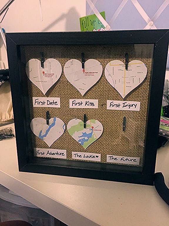 a bulletin board with hearts on it sitting on a desk