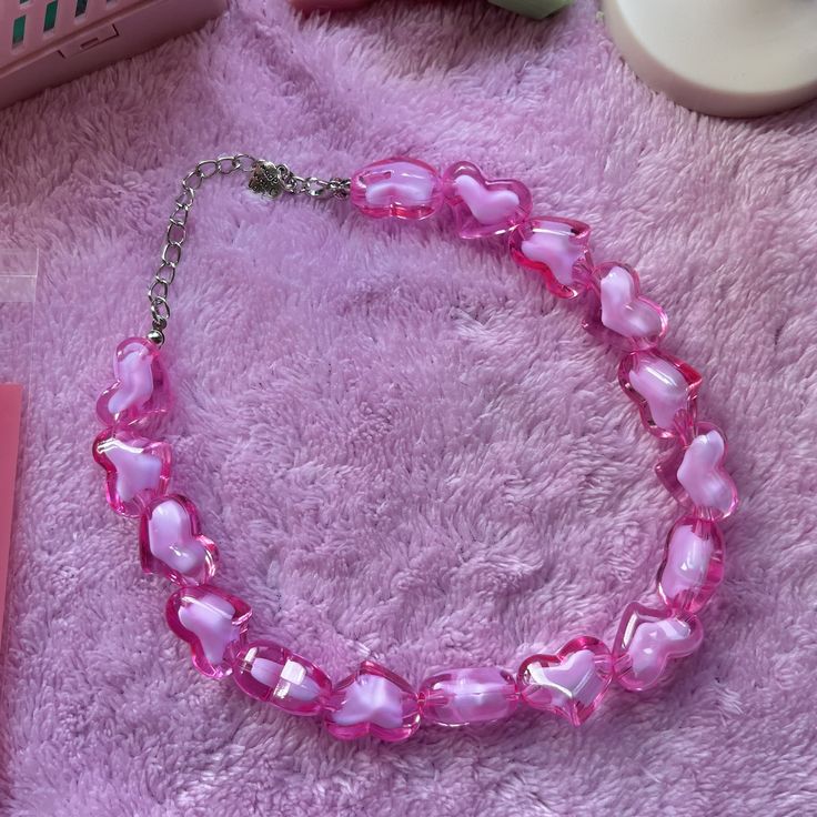 Baby pink chunky heart beads made into the prettiest choker necklace. This necklace is approx. 14 inches with a 3inch extender.  So fits perfect as a 'choker' necklace but can also be a normally necklace for smaller necks. Necklace is £10.00 UK Shipping: This is standard second class UK Shipping via Royal Mail. Proof of postage kept for a month. Rest of World: Standard Shipping. Proof of postage kept for a couple of months. Packaging: All items will be packaged in a cute bag with lots of bubble Pretty Choker Necklace, Pink Necklace, Heart Beads, Cute Bag, How To Make Beads, Cute Jewelry, A Month, Baby Pink, Royal Mail