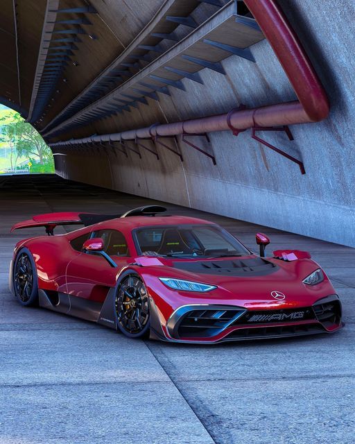 a red sports car is parked under a bridge