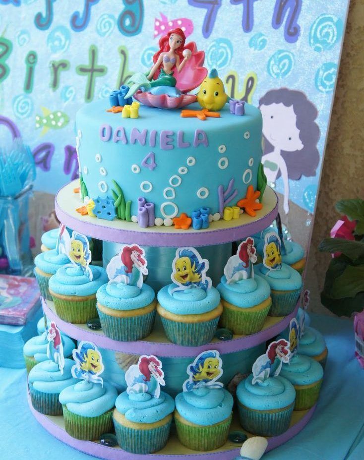 a little mermaid birthday cake and cupcakes