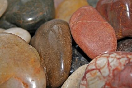 many different colored rocks sitting on top of each other