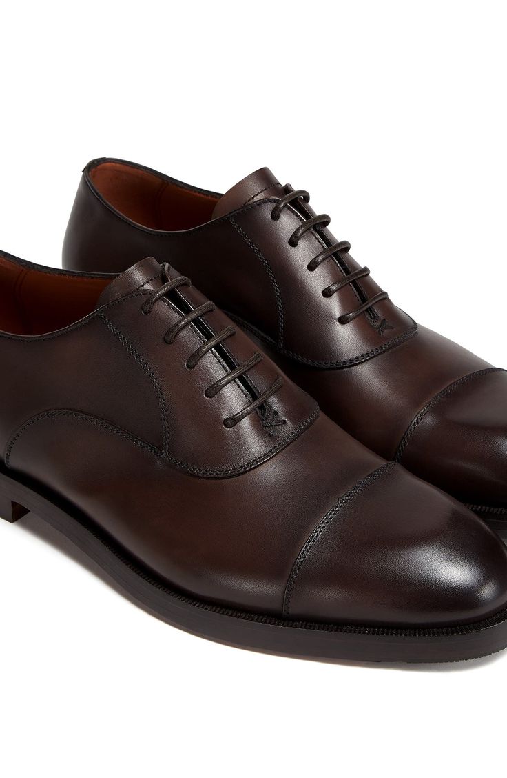 Crafted with flexible, lightweight Blake construction, this Italian-made oxford with a richly polished finish pairs classic elegance with contemporary flair. Lace-up style Leather upper and lining/leather and synthetic sole Made in Italy Men's Designer Shoes Elegant Cap Toe Derby Shoes For Work, Elegant Business Oxford Shoes With Cap Toe, Elegant Cap Toe Oxford For Business, Luxury Business Oxford Shoes, Elegant Cap Toe Oxford For Workwear, Luxury Fitted Derby Shoes For Business Casual, Luxury Fitted Derby For Business Casual, Fitted Elegant Derby For Office, Elegant Fitted Derby For Office