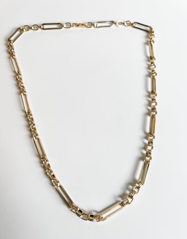 This vintage-inspired 14k gold filled link chain named the Dawn is the perfect balance of elegance and practicality for everyday use. The beautiful handmade craftsmanship of the chain adds a touch of sophistication to any outfit, making it a versatile and timeless piece. Upgrade your accessory game with Dawn Link chain. Everyday Brass Link Chain Necklace, Vintage Link Jewelry With Cable Chain, Vintage Jewelry With Cable Chain Link, Vintage Cable Chain Link Jewelry, Gold-tone 14k Gold Link Chain Necklace, Timeless Gold Chain Link Necklace, Timeless Gold Chain Necklace, Classic Brass Necklace With Oval Links, Classic Oval Link Brass Necklace