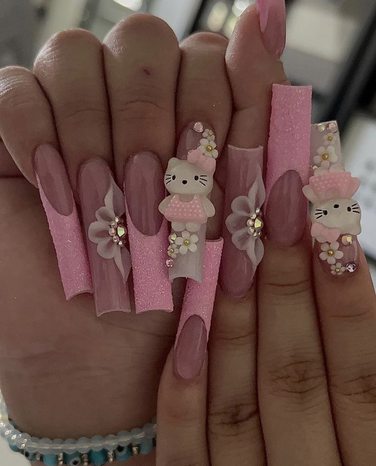 Cute Pink Hello Kitty Nails, Hello Kitty Nails With Flowers, Pink Nails With Hello Kitty Charms, Hot Pink Hello Kitty Nails, Hello Kitty Nail Inspo Acrylic, 3d Flower Nails Coffin, Purple Hello Kitty Nails, Nails Acrylic Hello Kitty, Y2k Hello Kitty Nails