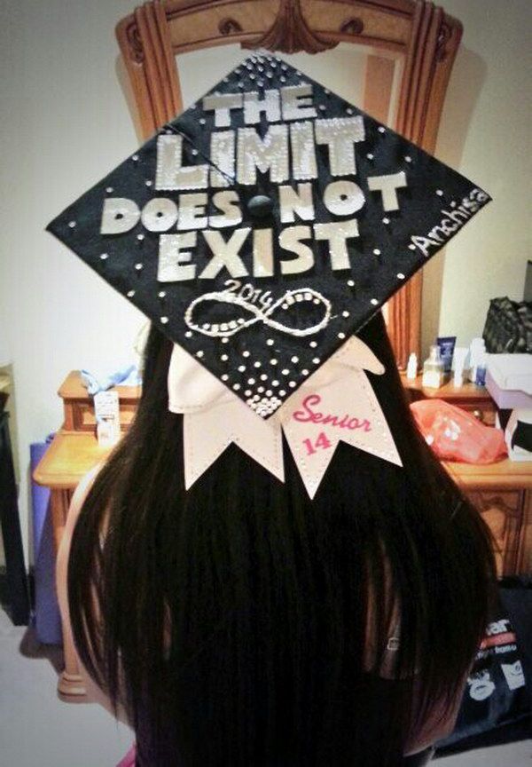 a girl wearing a graduation cap that says the limit does not exisit