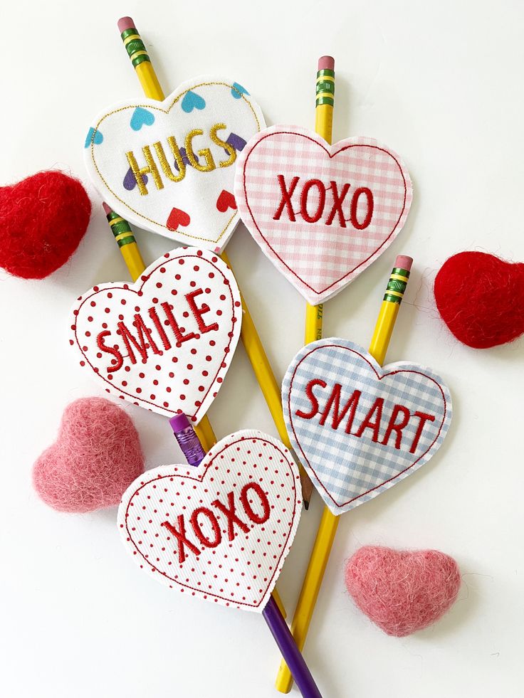 valentine's day crafts with pencils and crayons on white background for kids to make