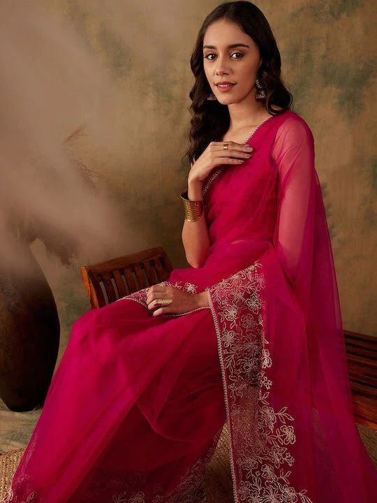 Magenta net sareeFloral embroidered saree with embroidered borderHas zari detailThe saree comes with an unstitched blouse pieceThe blouse worn by the model might be for modelling purpose only. Check the image of the blouse piece to understand how the actual blouse piece looks like. Wedding Sarees Online, Embroidered Saree, Wedding Saree Indian, Wedding Saree, Rich Fabric, The Model, Indian Design, Wedding Wear, Sarees Online