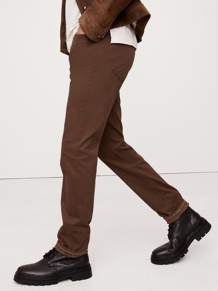 We updated our best-selling Traveler pant, keeping the same high-stretch comfort, but adding a more pronounced twill texture to the fabric.  Slim fit: Mid-rise.  Slim leg.  14" leg opening (from size 32).  Organic: Made with certified, organically grown cotton that's easier on the earth.  Fabric from Italy's Olimpias mill.  Zip fly with button closure.  Belt loops.  Five-pocket styling.  Slim fit: Mid-rise.  Slim leg.  Leg opening (from size 32): 14" Inseams: Short 30", Regular 32", Long 34" Mod Classic Brown Straight Bottoms, Brown Chinos With Pockets And Straight Hem, Brown Chino Cotton Twill Bottoms With Welt Pockets, Brown Straight Leg Chino Bottoms, Business Casual Brown Straight Leg Chinos, Brown Workwear Bottoms With Five Pockets, Straight Leg Bottoms With Comfort Waistband For Fall, Fall Bottoms With Comfort Waistband And Straight Leg, Brown Pants With Five Pockets And Straight Hem