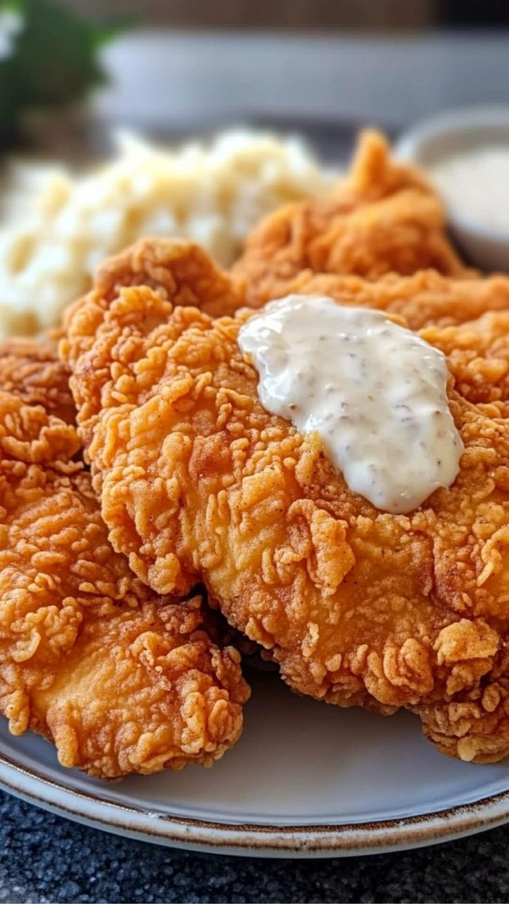 fried chicken with ranch dressing on a plate