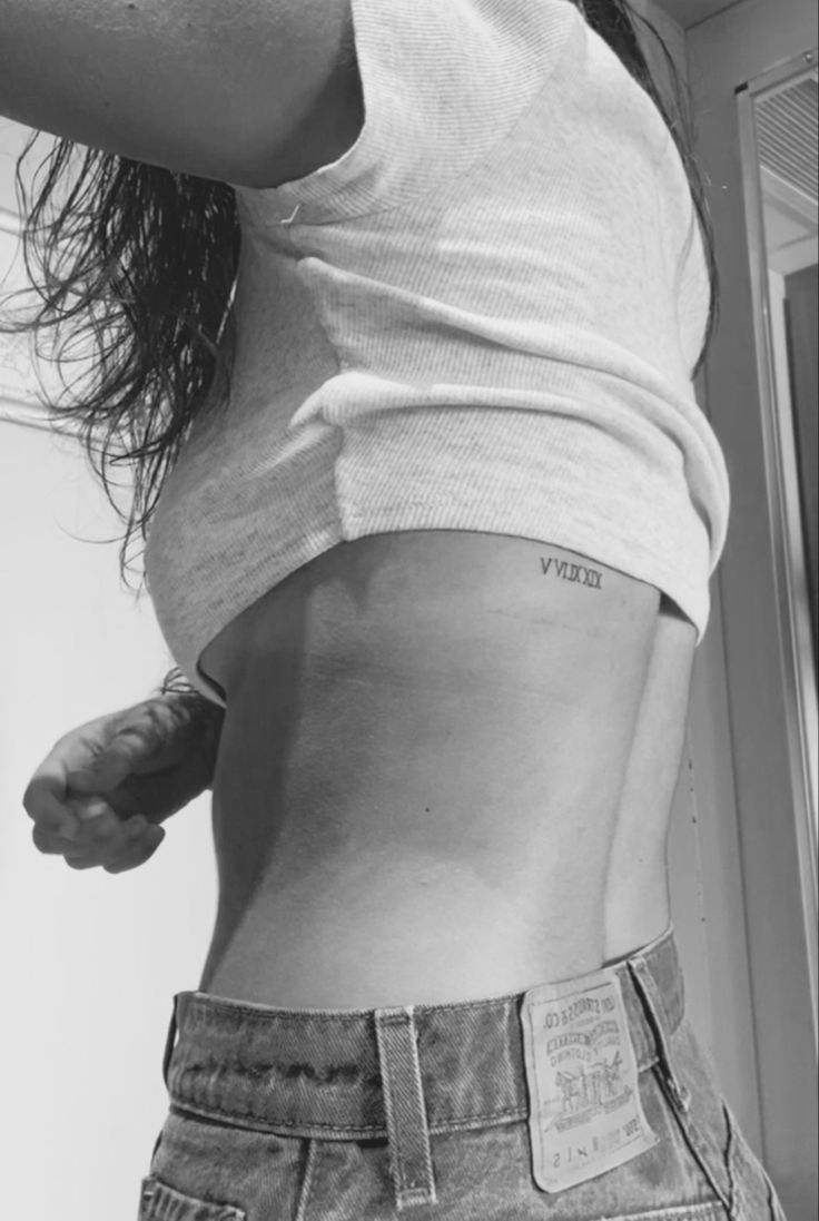 Back Tattoo Women Roman Numeral, Roman Numerals Back Tattoo, Back Roman Numeral Tattoo, Roman Numeral Back Tattoo Women, Roman Numeral Tattoo Ribs Women, Roman Numeral Back Tattoo, Roman Numeral Rib Tattoo, Dainty Roman Numeral Tattoo, Wedding Date Tattoos