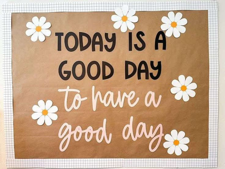 a brown paper bag with white daisies on it that says today is a good day to have a good day