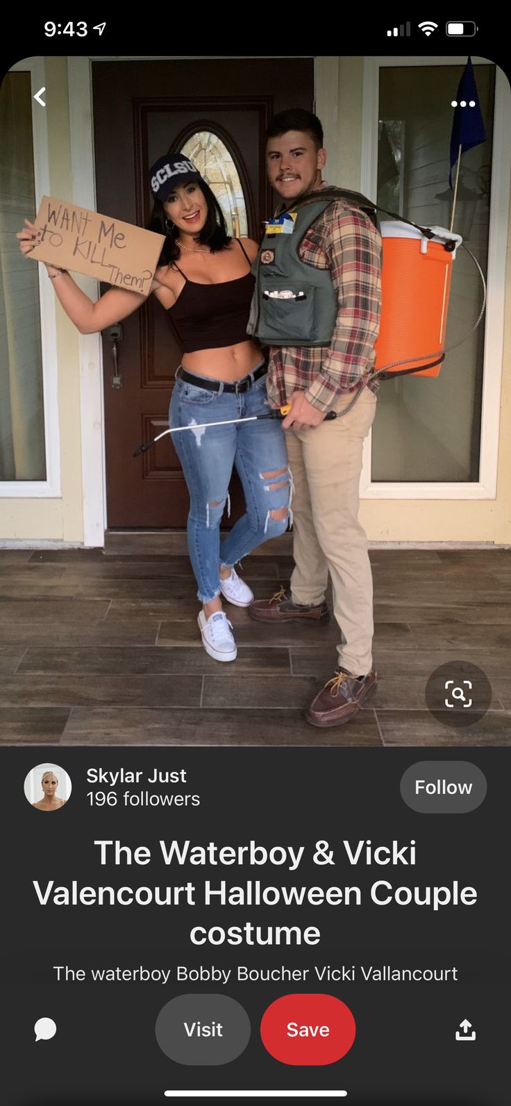 a man and woman standing next to each other in front of a house holding signs