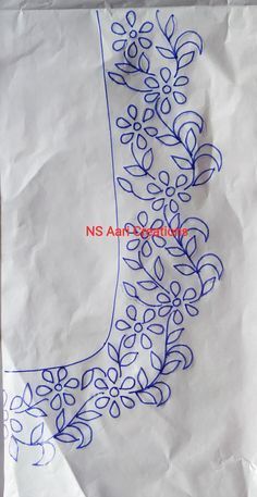 a piece of white paper with blue embroidery on it