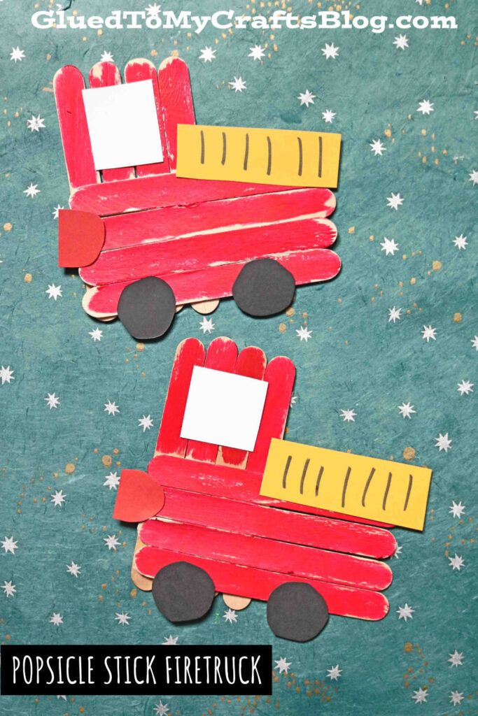 two popsicle stick firetrucks are sitting next to each other on a blue background