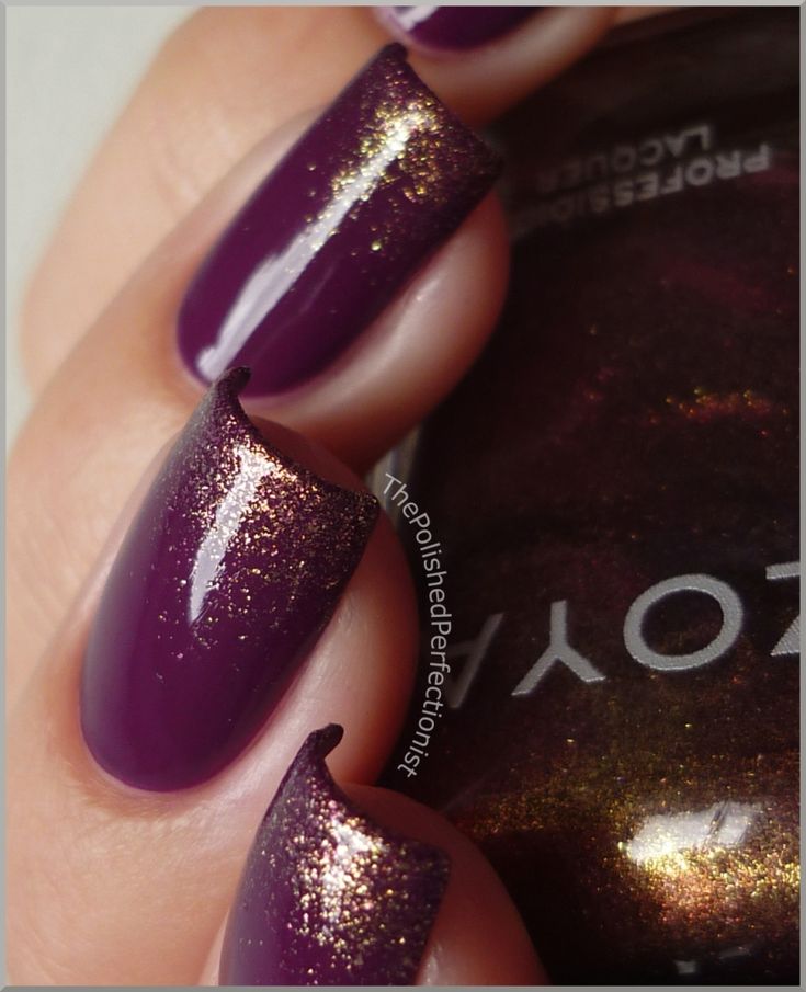 purple and gold nail polish with glitter on it