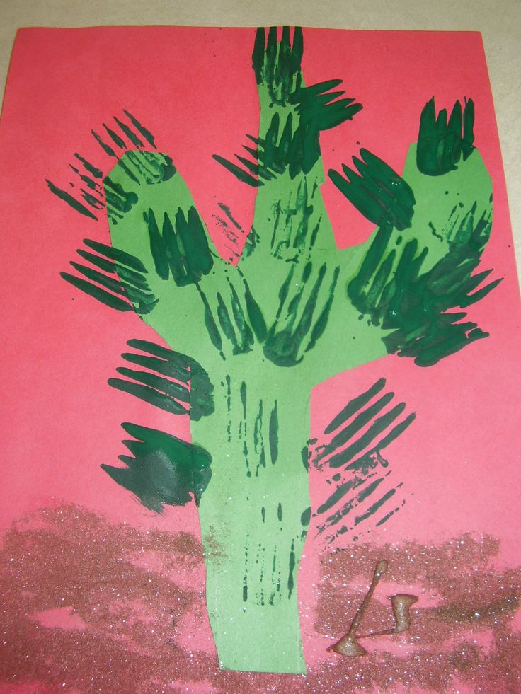 a cactus made out of construction paper on a pink and green background with the letter k