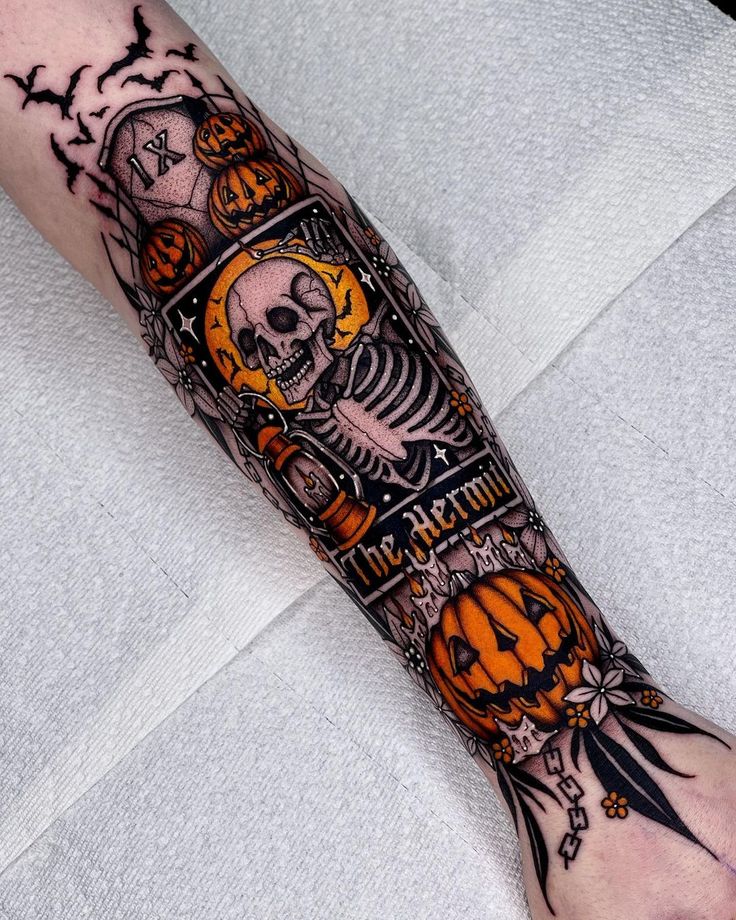 a man's arm with a skeleton and pumpkins tattoo design on it that says happy halloween