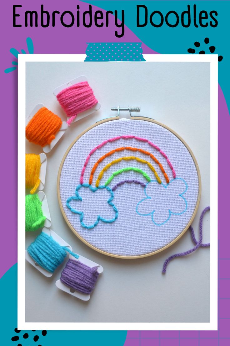 an embroidery kit with rainbows and yarn on it