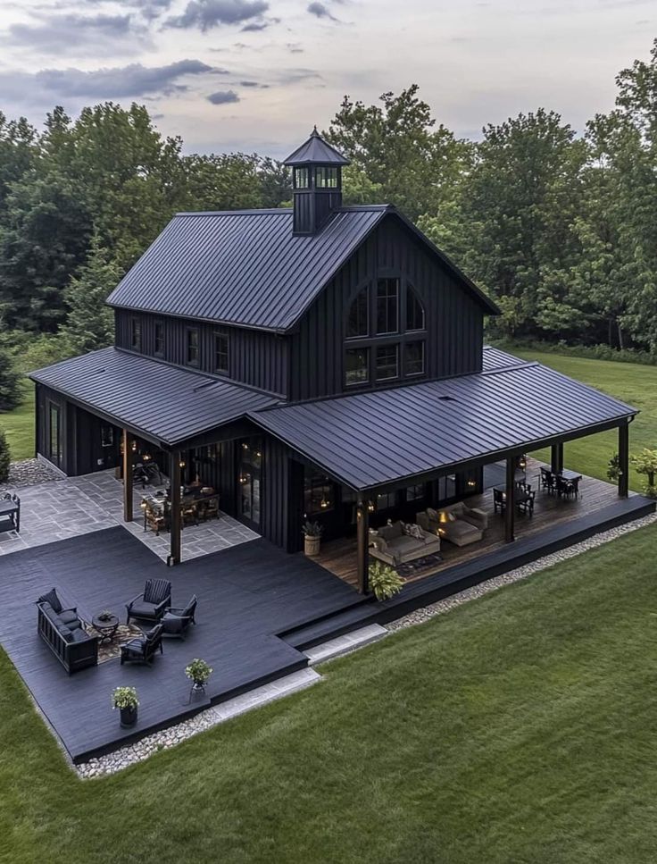 an aerial view of a large black house