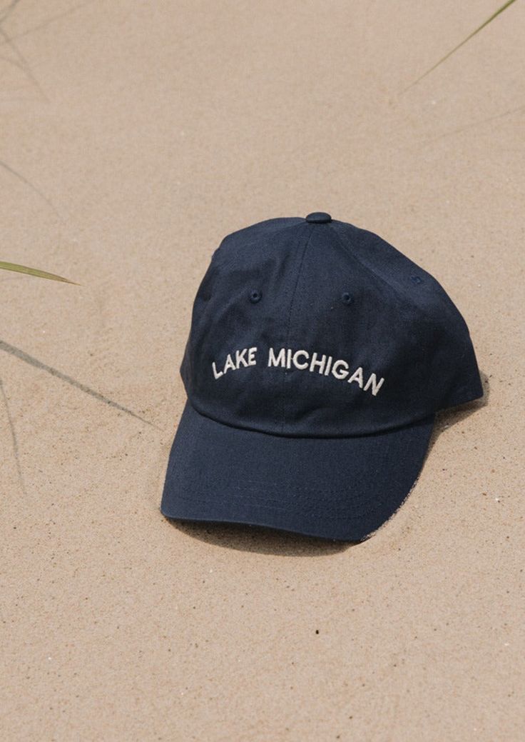 This Lake Michigan "Dad Hat" is a classic. The vintage denim color is sure to match every outfit all year round. Embroidered locally in Grand Rapids. Regular fit 100% Cotton Hand wash Summer Baseball Cap With Curved Brim In Medium Wash, Casual Flat Brim Baseball Cap Made In Usa, Summer Curved Brim Baseball Cap, Cotton Hats For Outdoor Fall Activities, Cotton Cap For Fall, Navy Cotton Hat With Embroidered Logo, Vintage Cotton Dad Hat One Size, Cotton Dad Hat For Beach With Flat Brim, Vintage Cotton Dad Hat One Size Fits Most