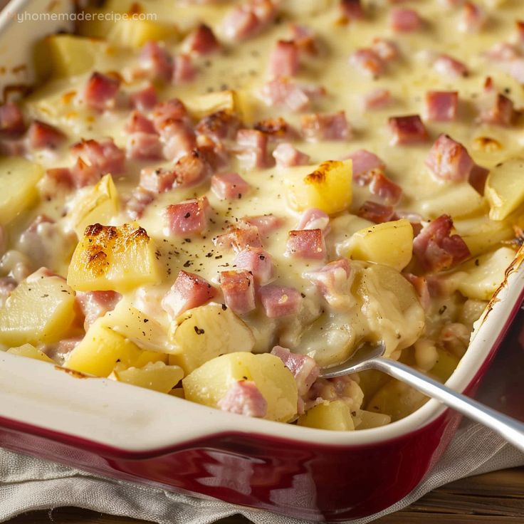 a casserole dish with ham and potatoes