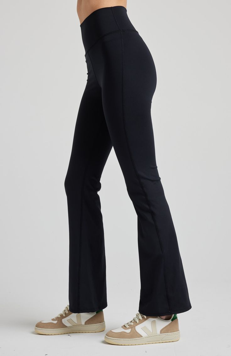 These leggings feature a high-rise waistband and a flirtatious flare below the knee, evoking memories of carefree days. Crafted from our high-performance SculptLux fabric, they wrap you in a luxurious second-skin embrace, offering support that allows you to move gracefully through life's every step. At LOSANO we help elevate every moment with clothing that is better for you! High waist Bootcut flare Sculpting Moisture wicking UV protective PFA Free BPA free Made from sustainable materials Oeko-t Fitted Full Length Activewear With Contoured Waistband, High Rise Fitted Athleisure Tights, Fitted Full-length Activewear With Wide Waistband, Fitted High Rise Gym Bottoms, High-rise Fitted Gym Bottoms, High Rise Fitted Gym Bottoms, Mid-rise Compression Yoga Pants, Mid-rise Fitted Tights For Athleisure, Mid-rise Compression Bottoms With Contoured Waistband