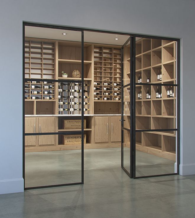 an empty room with glass doors and shelves