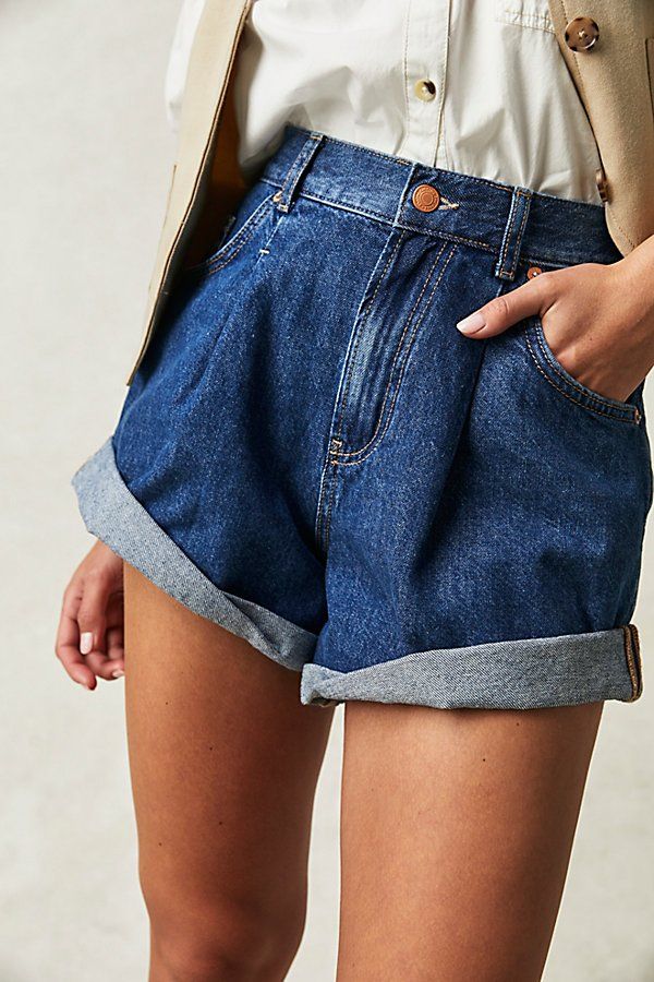 Perfectly pleated, these timeless denim shorts from our We The Free collection have the perfect touch of vintage-inspired charm. **Fit:** High-rise, relaxed tapered silhouette **Features:** Zip fly and button closure, five-pocket design, cuffed hemlines, rigid denim fabrication **Why We ❤ It:** Perfectly paired with a simple tee or elevated with a sheer blouse, these shorts have endless ways to wear. | We The Free Danni Shorts at Free People in Dark Wash, Size: L Cuffed Denim Shorts, Simple Tees, Cuffed Shorts, High Rise Shorts, Sheer Blouse, Dressed Down, Pocket Design, Denim Fashion, Boho Outfits