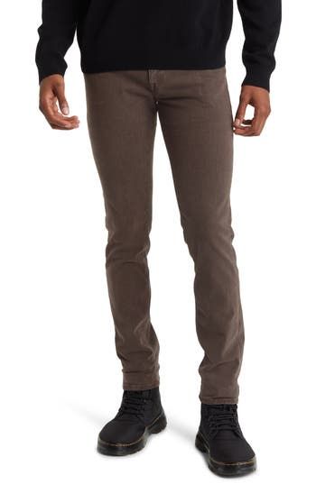 A sharp balance of casual and elevated, these slim-tailored pants keep you comfy in superstretchy brushed twill sourced from breathable, sustainable fibers. 32" inseam; 13" leg opening; 9" front rise; 13 1/2" back rise (size 29) Zip fly with button closure Five-pocket style 74% lyocell, 17% modal, 7% elasterell-p, 2% elastane Machine wash, dry flat Made in Turkey Brown Pants With Five Pockets Straight Hem, Brown Pants With Five Pockets And Straight Hem, Fitted Brown Bottoms With Five Pockets, Brown Straight Hem Pants With Five Pockets, Brown Fitted Straight Pants, Modern Fitted Brown Bottoms, Brown Straight Bottoms With Five Pockets, Brown Straight Pants With Five Pockets, Fitted Straight Brown Bottoms