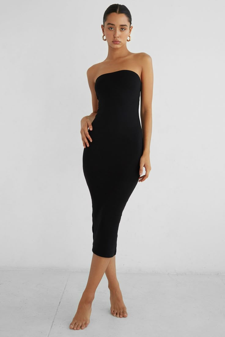 Crafted in our signature double layered modal fabric, this midi-length dress comfortably hugs the body’s curves while producing a strong silhouette. The body-con style is met with a back vent for additional movement and small rubber lining along the inside top seam. Pair with our Bobbi Blazer to complete the look. Black Tube Dress Outfit, Black Dress Layering, Dress With Shirt Underneath, Tube Dress Outfit, Black Strapless Bodycon Dress, Long Tube Dress, Black Tube Dress, Strapless Dress Black, Dress Layering