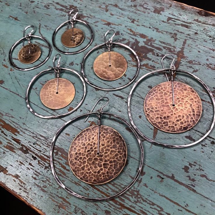 "Circles within circles, within circles... all to create a round and organic earring shape. Hammered brass disks with oxidized, forged, sterling silver circles. Big, bold, rustic and still lightweight. Versatile, great with a dress or jeans. Around 2 1/4\" diameter." Organic Earrings, Half Moon Necklace, Burlington Vt, Abstract Jewelry, Hammered Brass, Find Objects, Small Jewelry Box, Cluster Necklace, Upcycled Jewelry