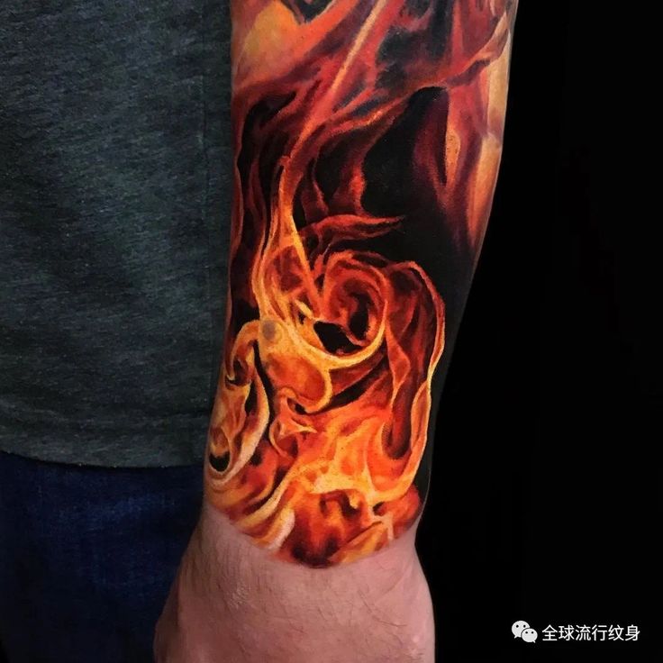 a man's arm with flames on it