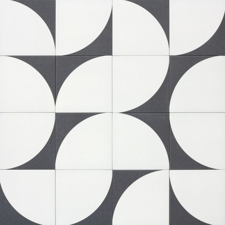 a black and white tile with circles on the back ground in an abstract pattern that looks like it has been made out of ceramic tiles