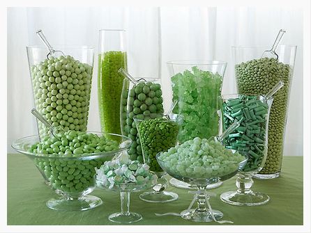 there are many different types of candies in glass vases